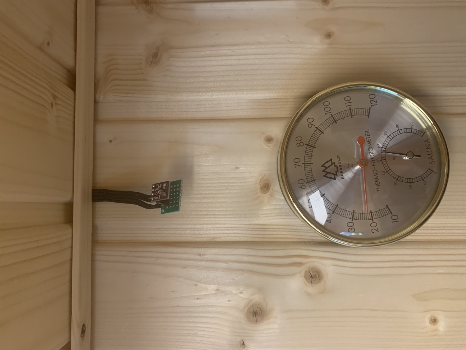 How the BME280 sensor was originally mounted in the sauna - unprotected. Note the analog temperature gauge below. That gauge was how I first found out that the BME280 temperature was so much off.