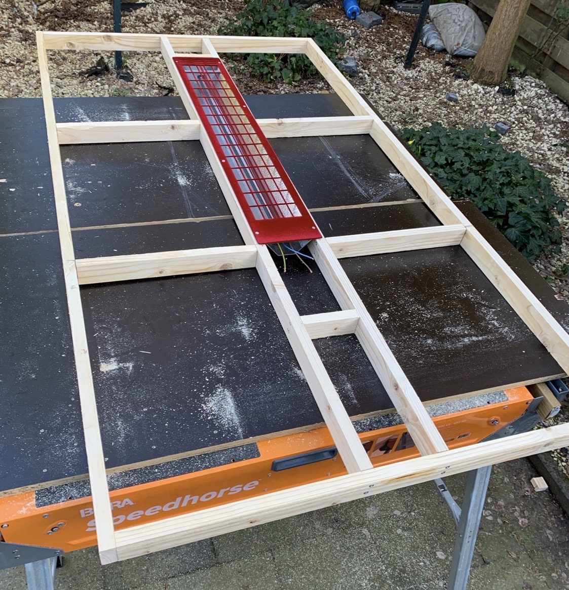 Back wall frame built, with embedded IR heater.